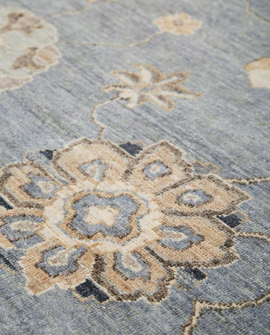 Detailed image of floral Cadiz rug in blue colour