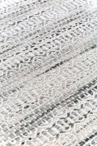 Detailed image of textured Plait Tempest rug in ivory colour
