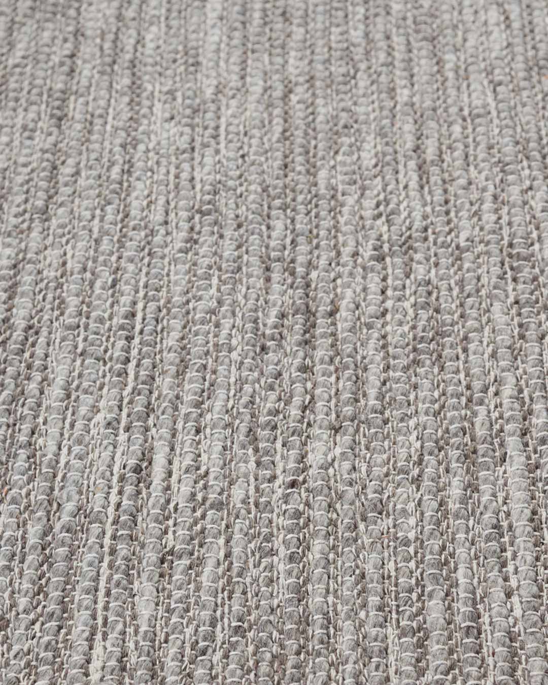 Close up view of textured Stylo rug in light grey colour