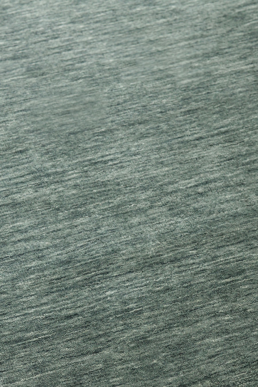 Detailed view of textured Zen rug in green colour