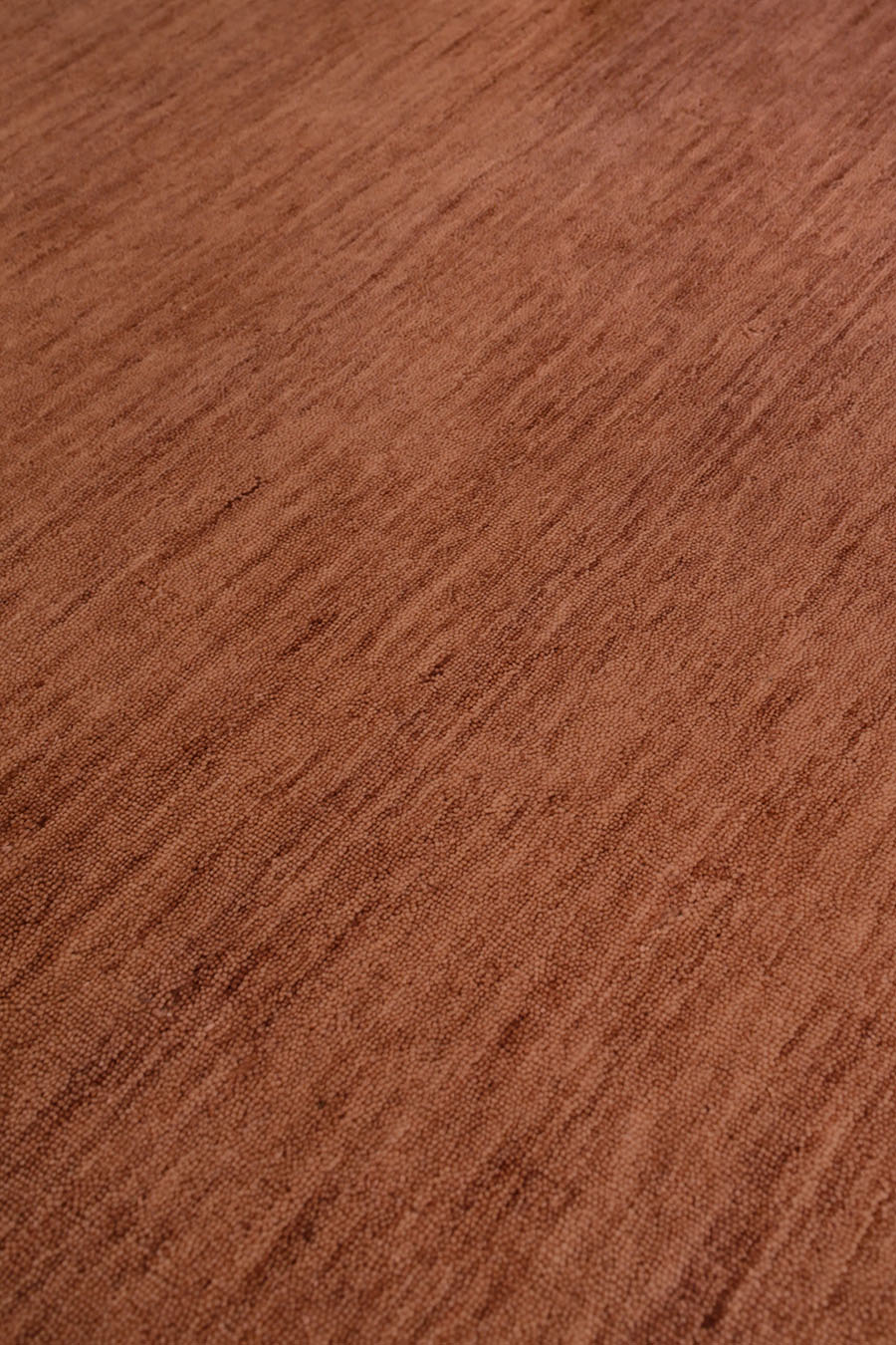 Close up view of textured Zen rug in ochre colour