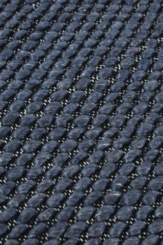 Detailed view of textured Cocos rug in navy blue colour