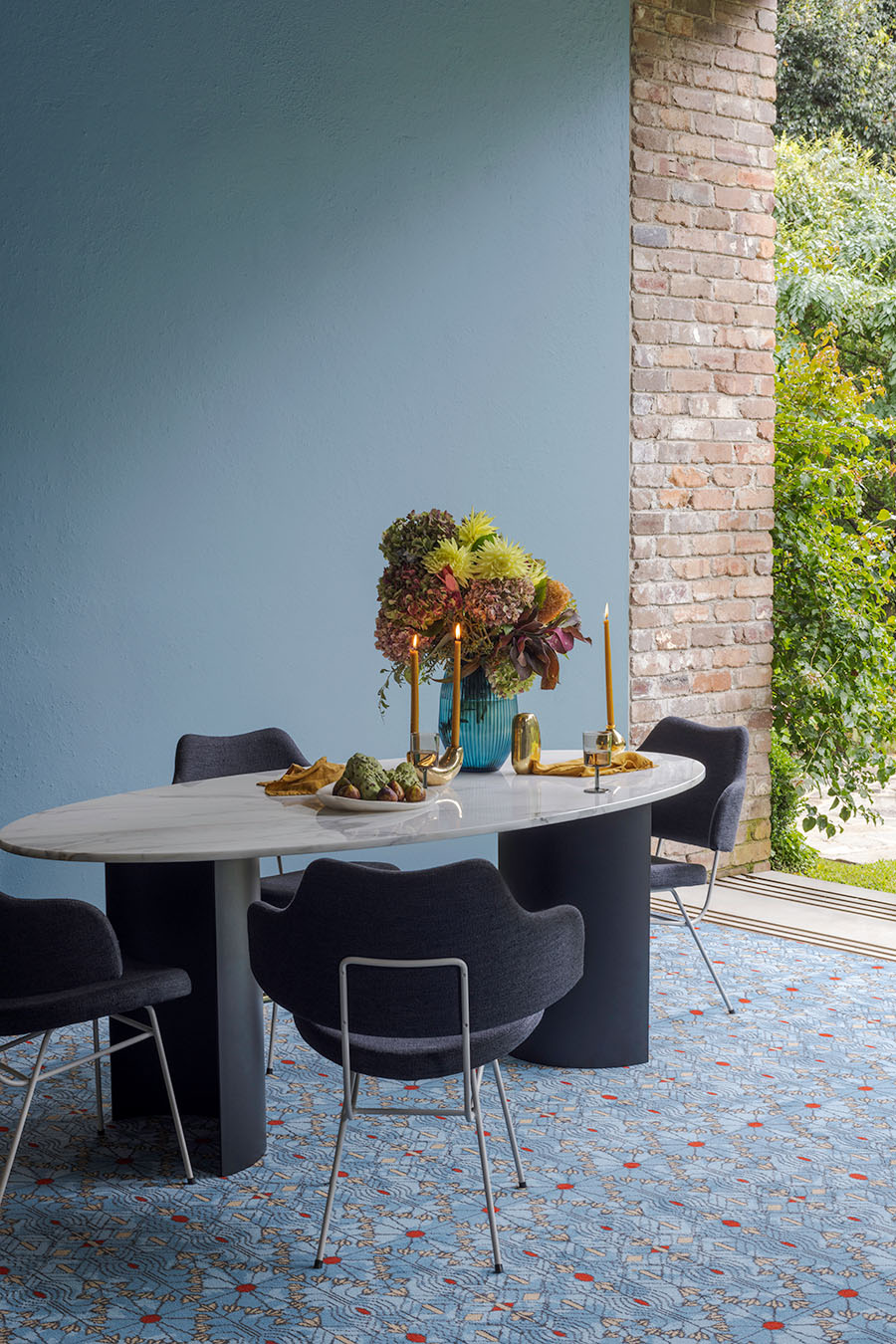 Dining room view of patterned Tree Of Life carpet in blue