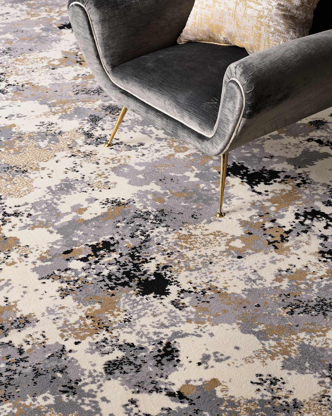 Close up view of Fizz grey and gold patterned Axminster carpet by Greg Natale