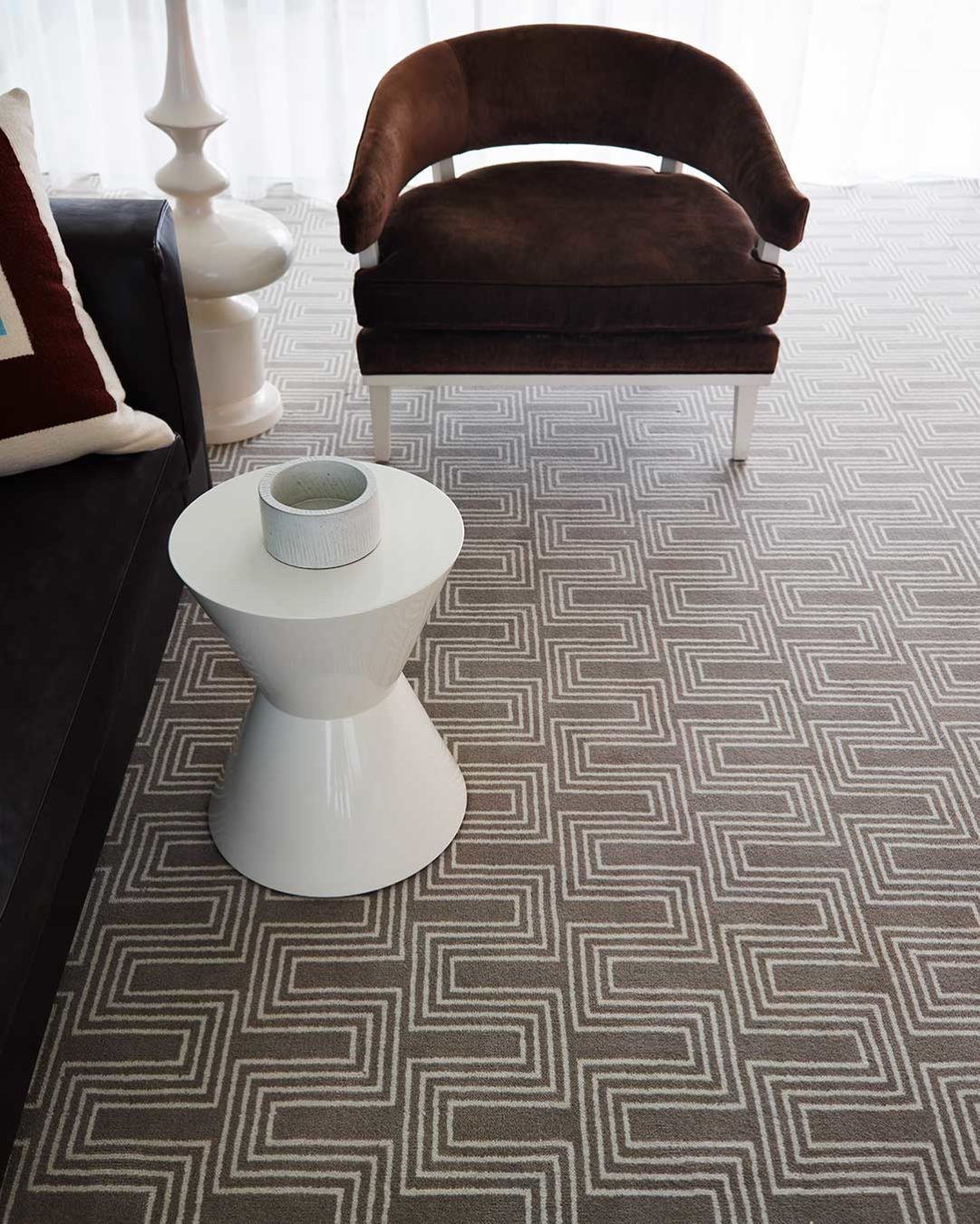 Close up view of Yves beige patterned Axminster carpet by Greg Natale