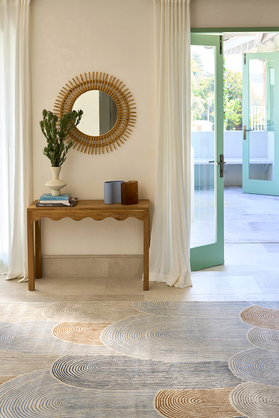 Entryway image of abstract arches Haven rug in brown and blue