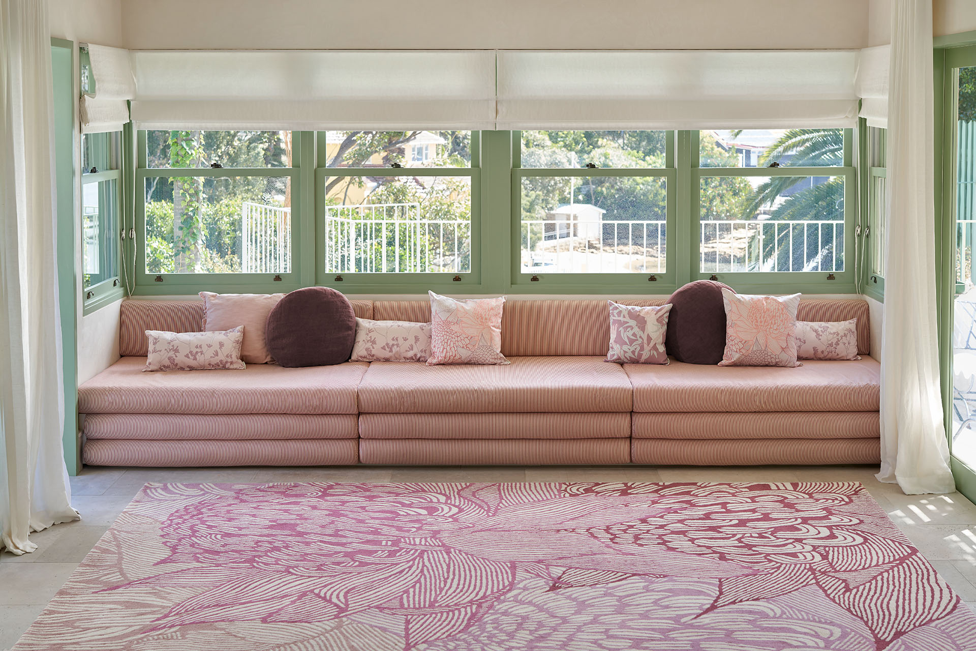 Living room image of pink floral Telopea Bloom rug