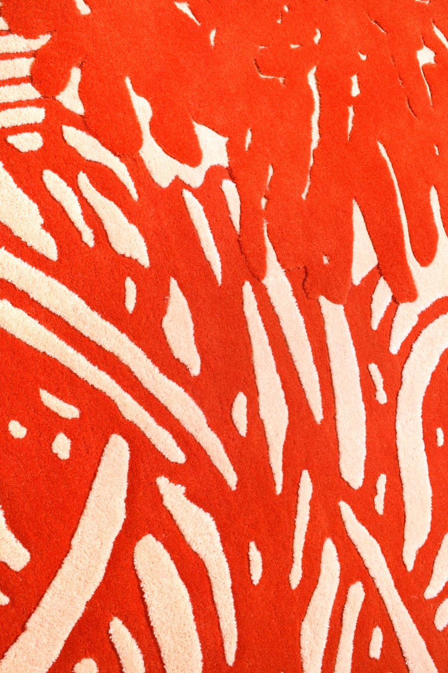 close up of nara 1 rug by akira in coral floral pattern