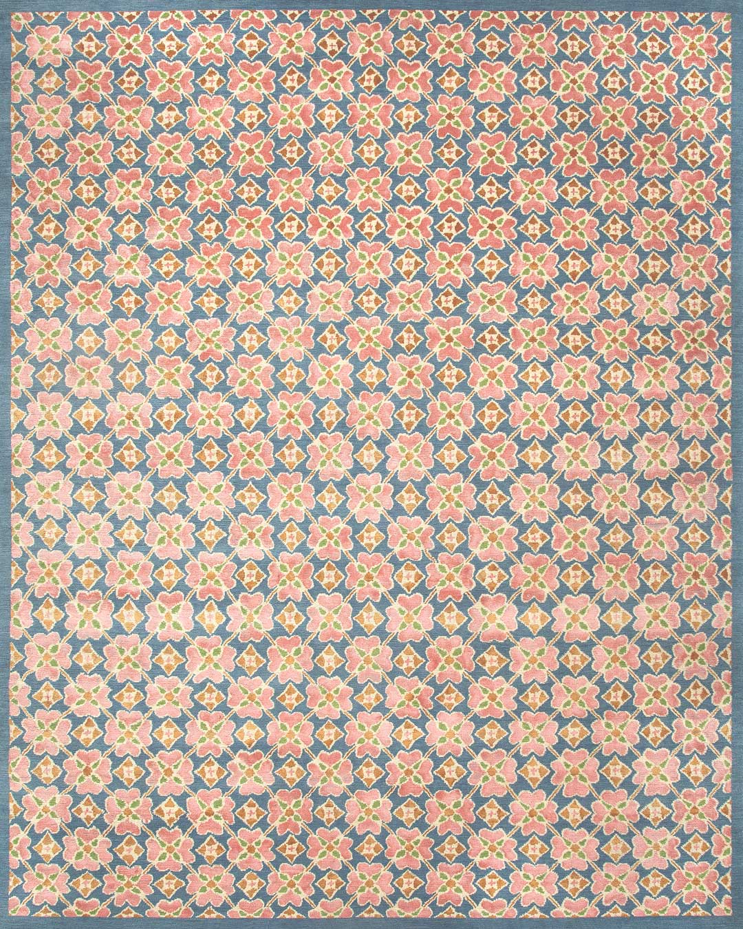 overhead of flora rug by anna spiro in floral repeat pattern with a blue border