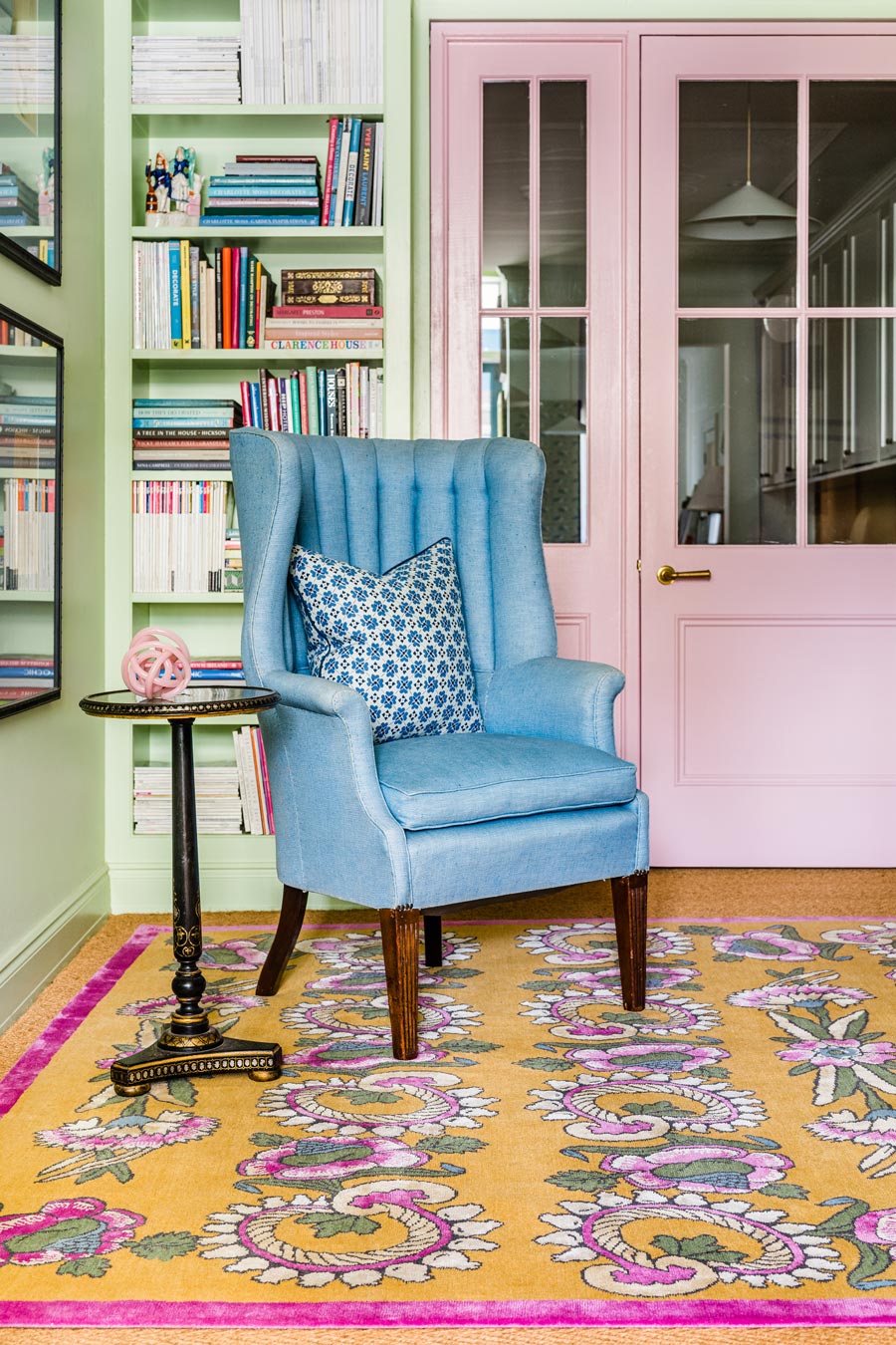 location shot of kandilli rug by anna spiro in abstract floral pattern mustard background and pink border