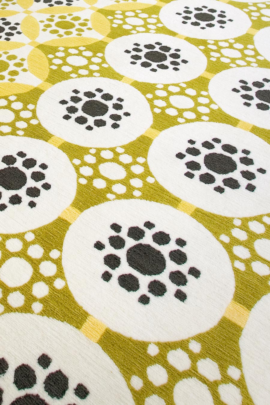 close up of applique rug by bernabeifreeman in yellow circular pattern