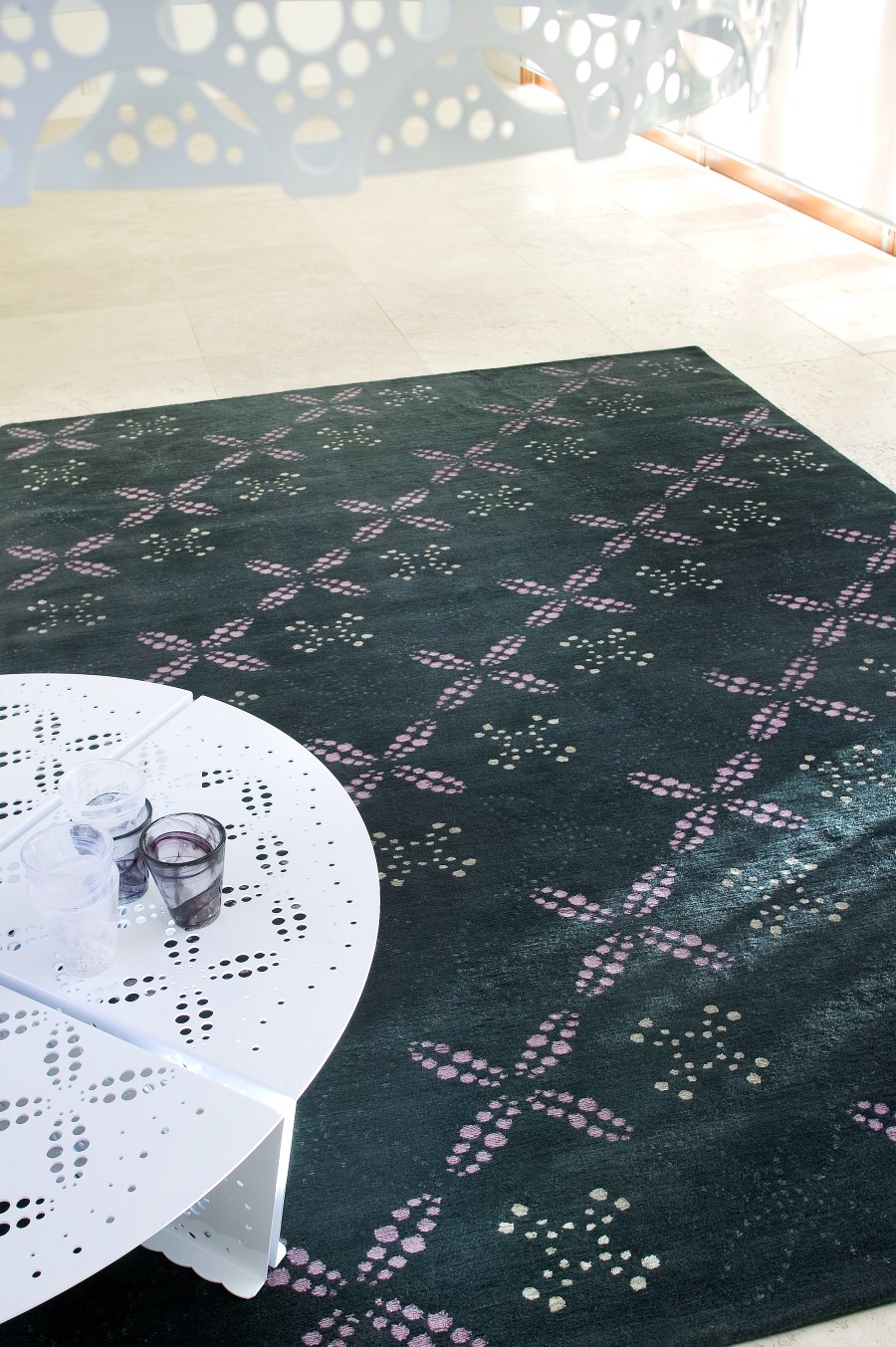 close up of brodie rug by bernabeifreeman in charcoal geometric dot pattern