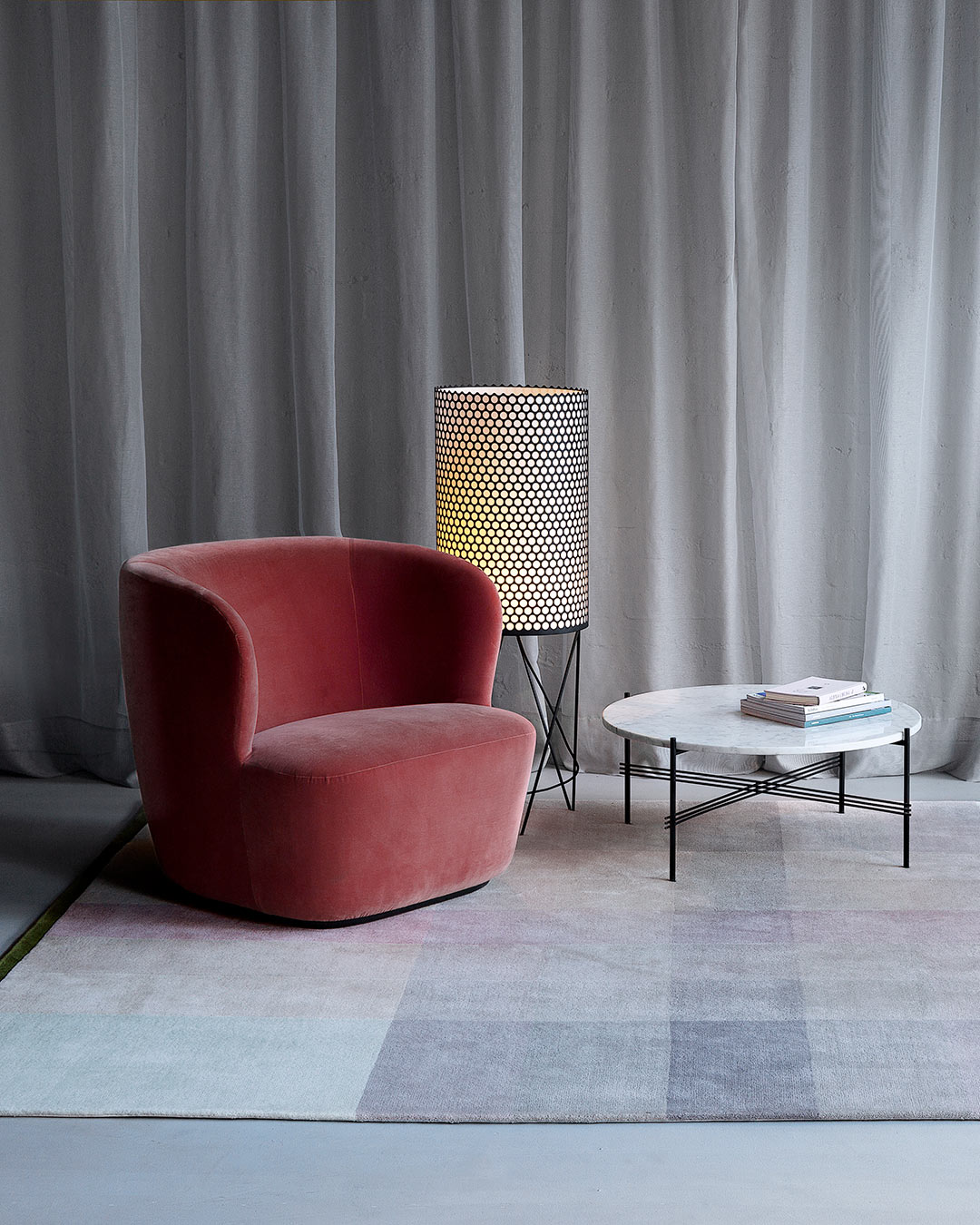 location shot of crossing rug by bernabeifreeman in large checkered pattern in pale pink beige and brown