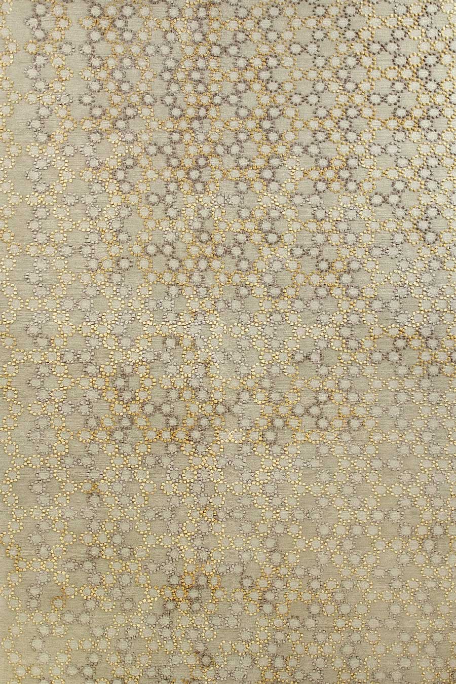overhead of folk rug by bernabeifreeman in yellow and beige circular pattern