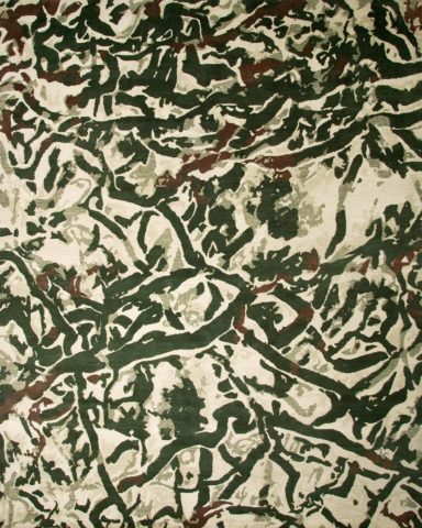 overhead of black map rug by caroline baum beige background organic green lines