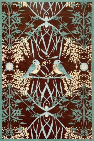 overhead of acacia rug by catherine martin teal bird print on brown background