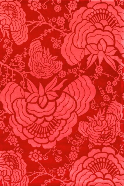 overhead of peony rug by catherine martin red floral pattern
