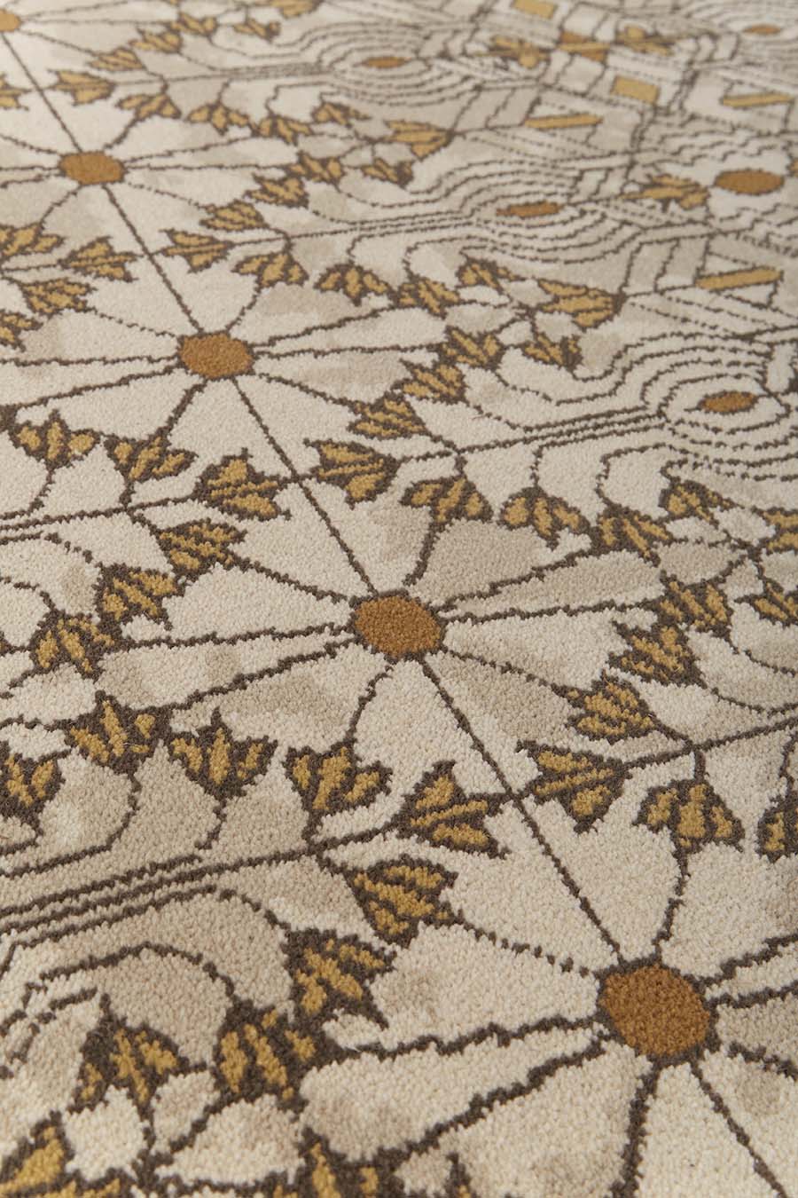 Detailed view of patterned Tree Of Life carpet in beige