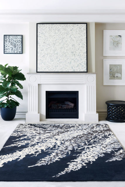 location living room shot of blossom dance rug by felicia aroney whote floral on navy background