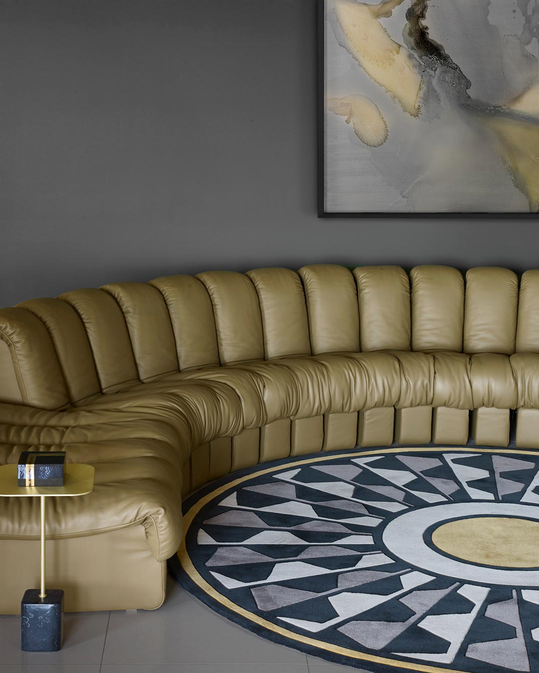 location living room shot of central park round rug by greg natale