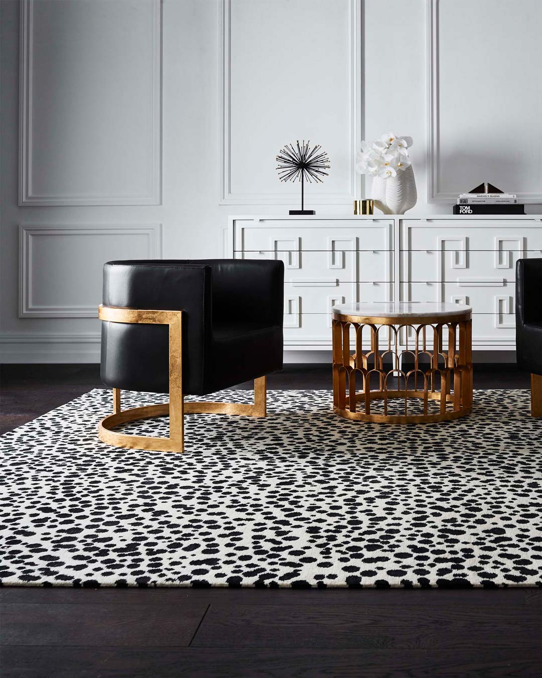 location shot of dapple rug by greg natale black dots on white background