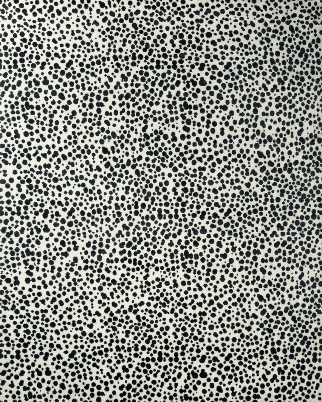 overhead of dapple rug by greg natale black dots on white background