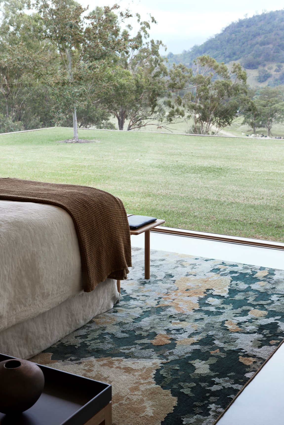 location image of organic Terrain handknot rug by Hare and Klein in silver,