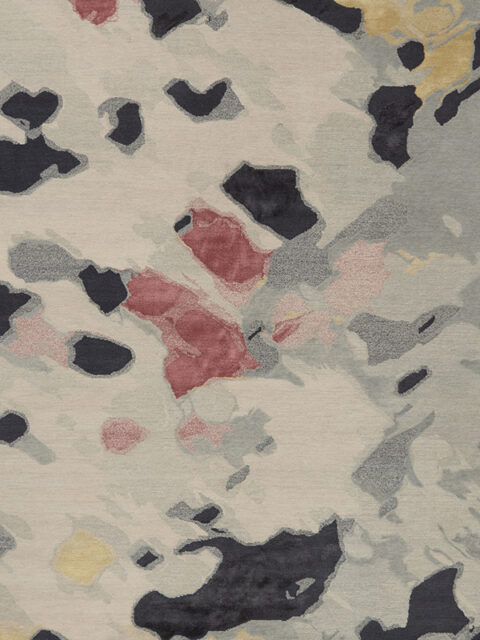 Overhead image of organic petale handknot rug by Hare and Klein in pink, beige , charcoal and yellow