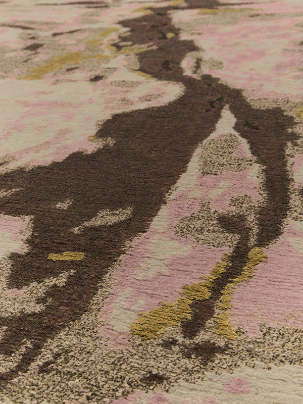 Close up image of organic crevasse handknot rug by Hare and Klein in pink, gold and beige