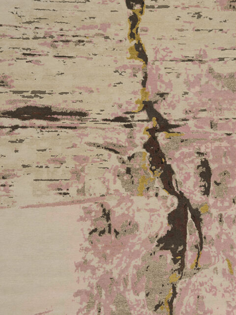 Overhead image of organic crevasse handknot rug by Hare and Klein in pink, gold and beige