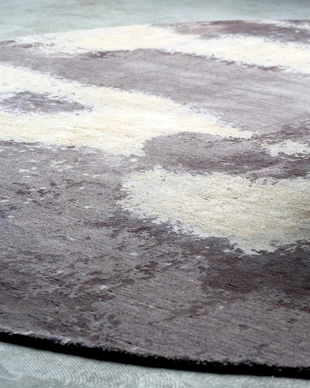 Detailed image of textural Landscape rug by Hare and Klein in grey colour