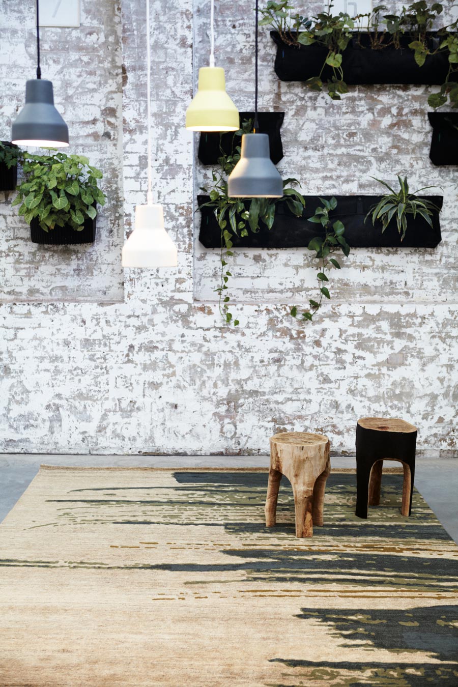 Styled image of textural Swept handknot rug by Hare and Klein in green colour