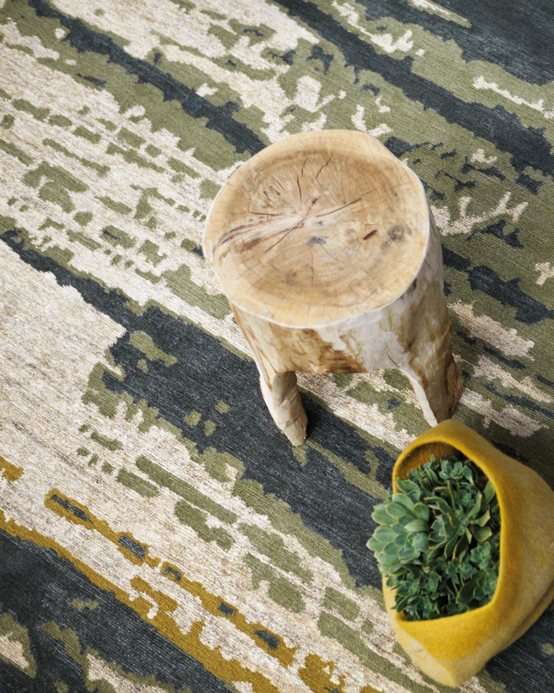 Close up image of textural Swept handknot rug by Hare and Klein in green colour
