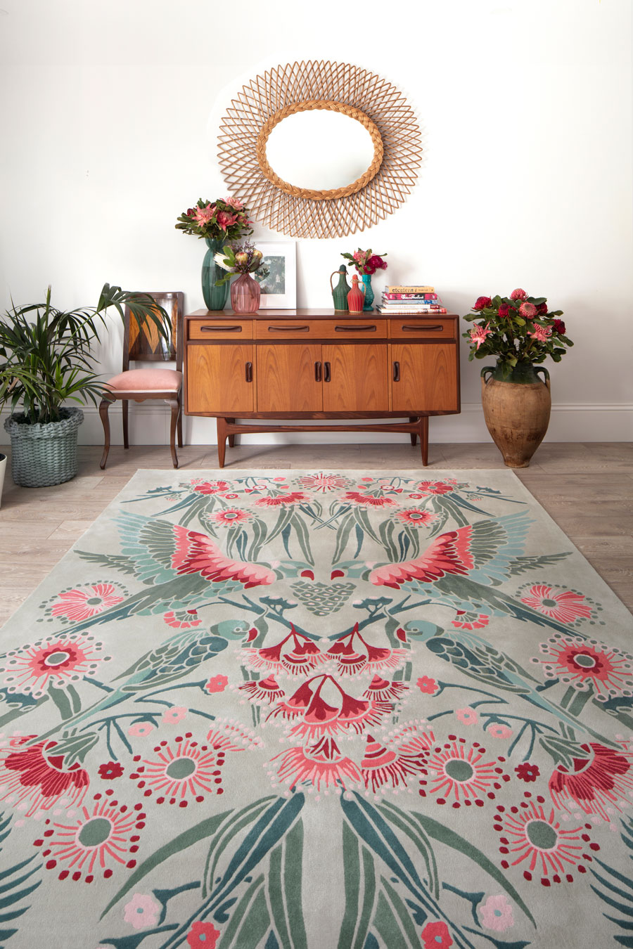 Overhead image of floral Gumnut Paradise rug by House Of Heras in mint green colour