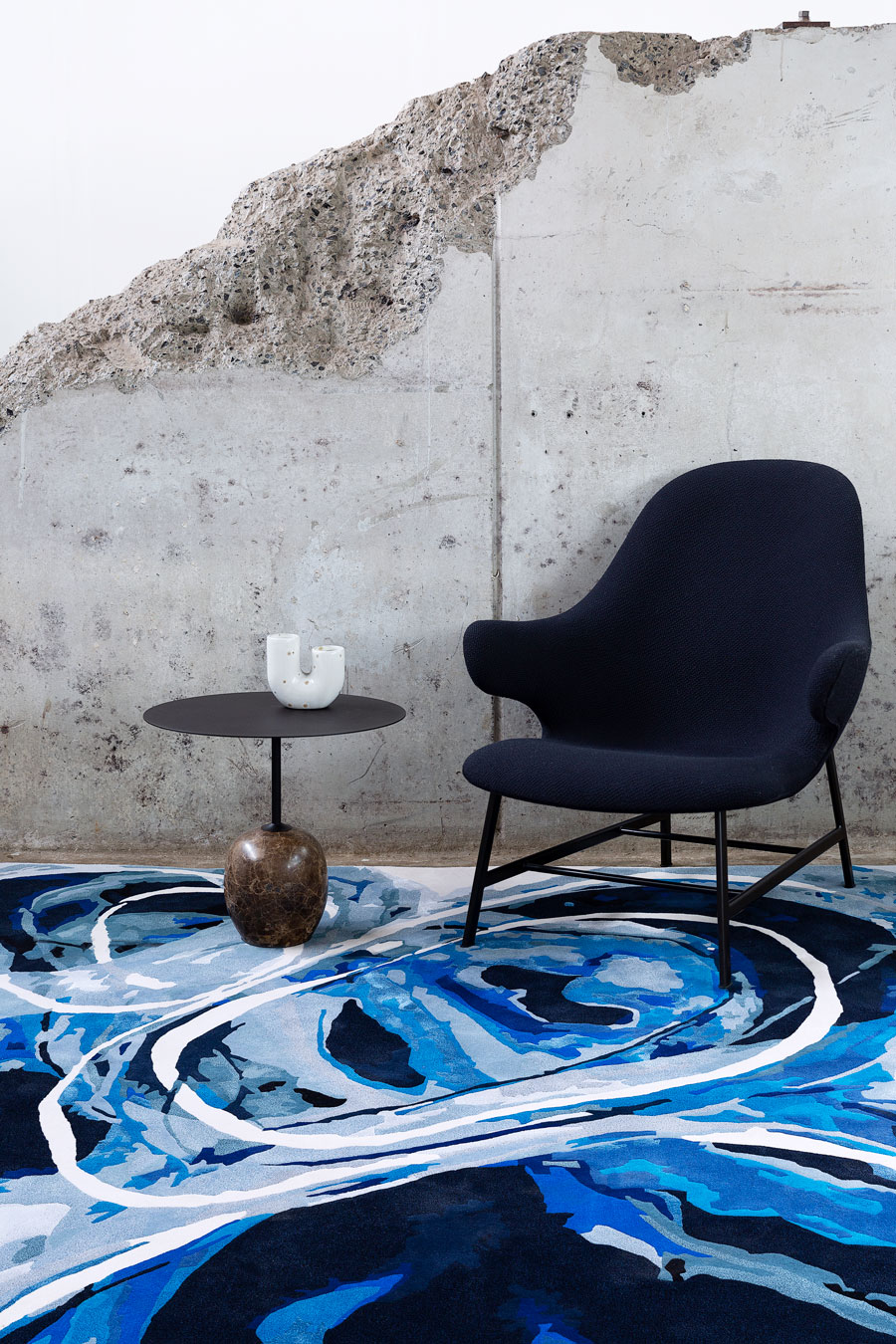Styled image of painterly Deluge rug by Lara Scolari in blue colour
