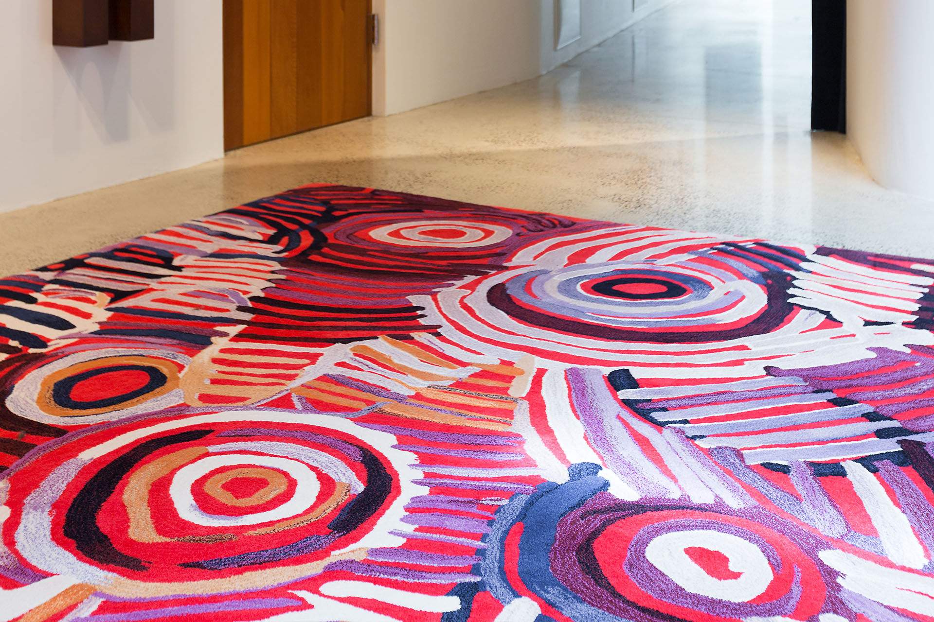 Overhead image of indigenous Celebration rug by Minnie Pwerle in pink colour