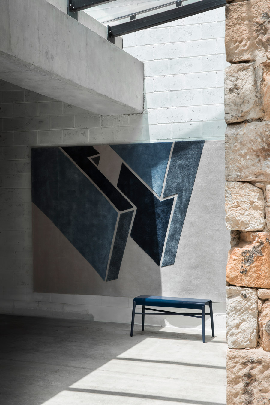 Styled image of geometric Corner Halving rug by Mr Frag in blue colour