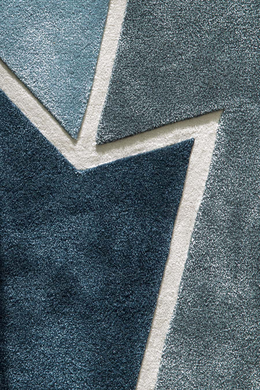 Close up image of geometric Corner Halving rug by Mr Frag in blue colour