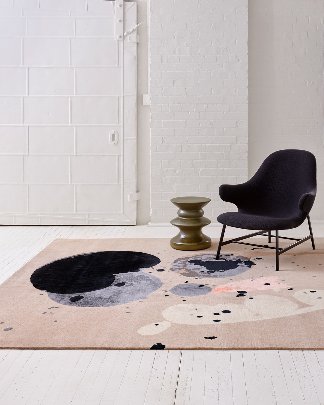 Living room image of painterly Seed Pod rug by Louise Olsen in grey colour