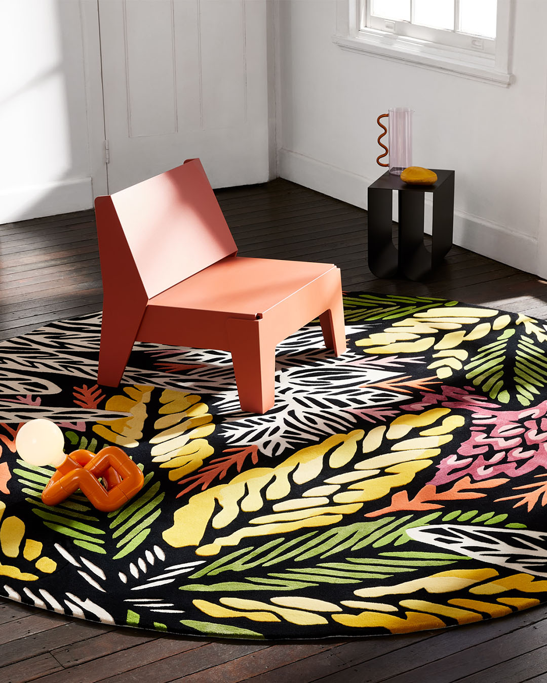 Styled image of round floral Complex Ecologies rug by Tamika Grant Iramu