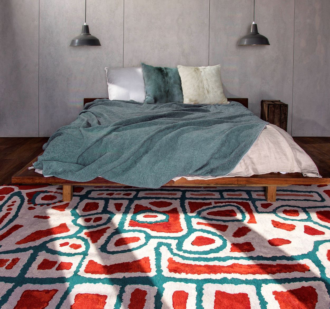 Indigenous Lungarung rug in red and green colour in a coastal setting