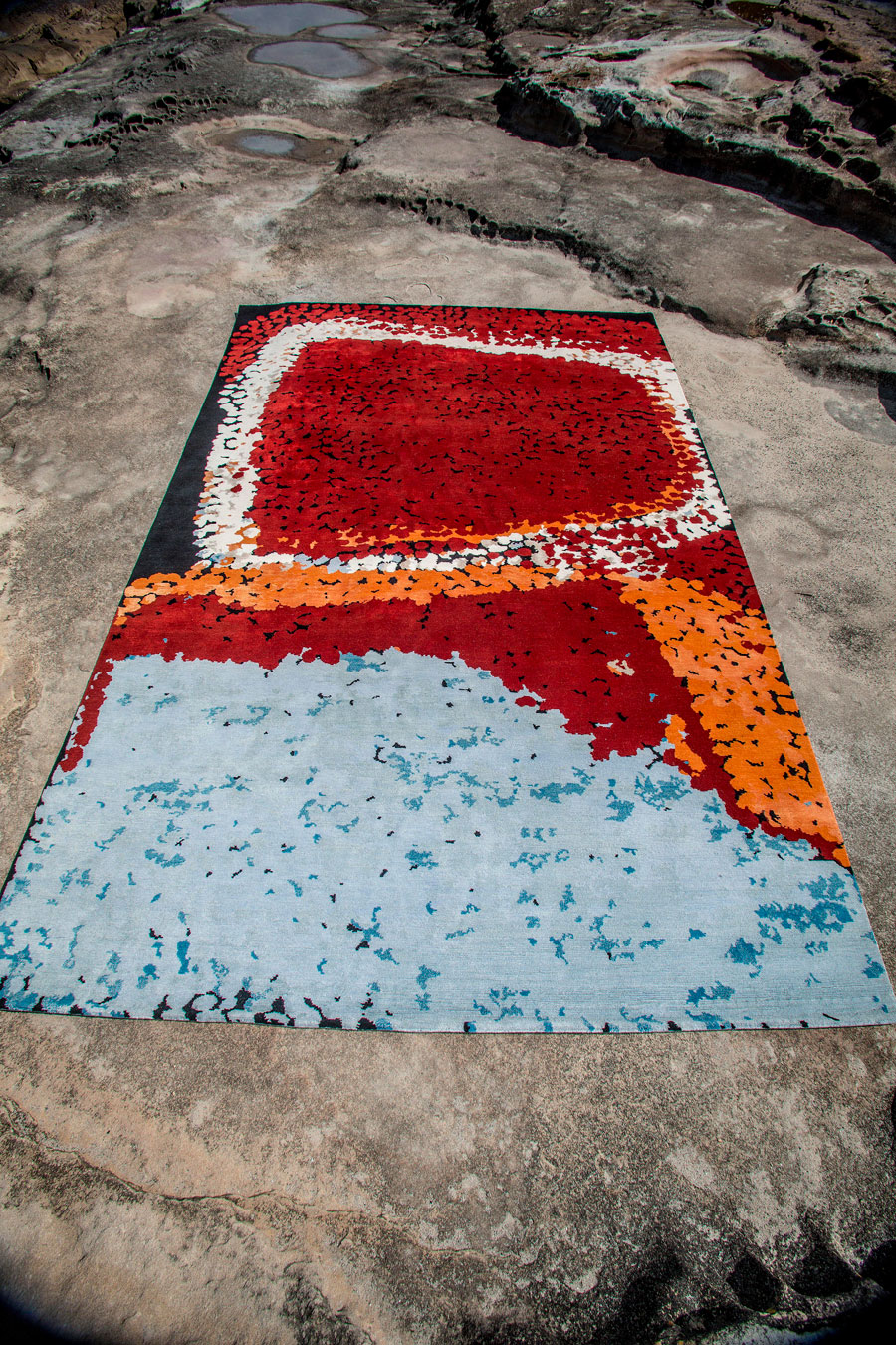 Overhead view of indigenous Lungarung rug in red colour