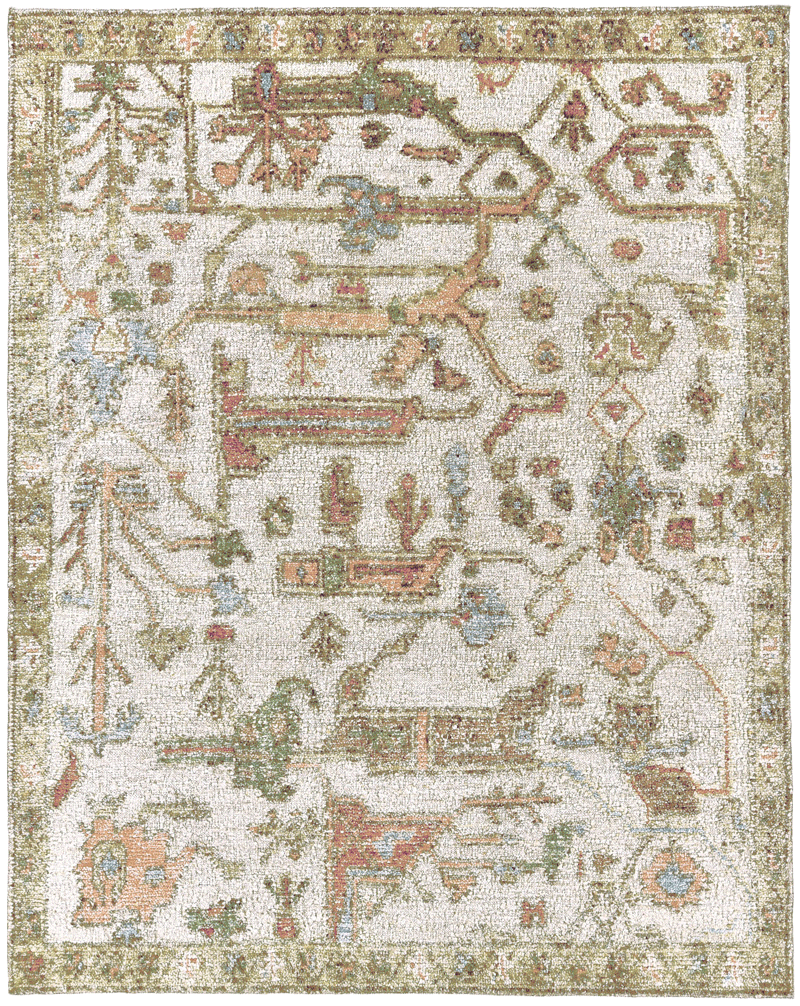 overhead image of the Biraz rug from the Oushak Collection, featuring a traditional pattern in cream, olive, terracotta and turquoise beneath a tan leather chair.