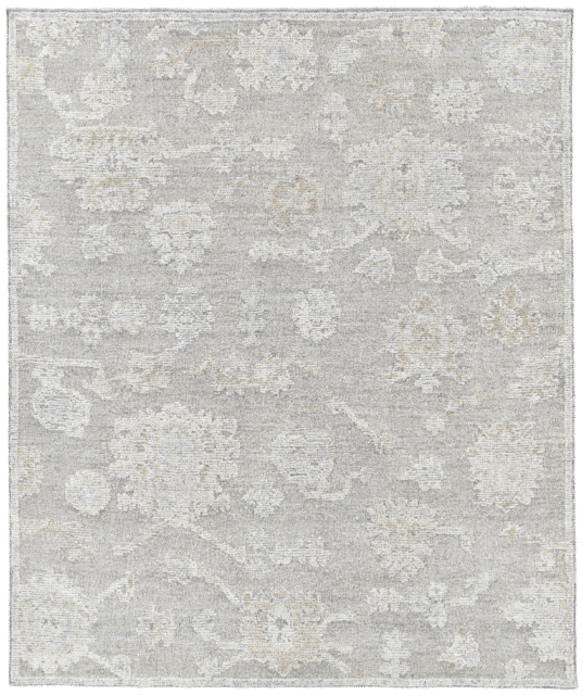 Overhead image of the Olan rug from the Oushak Collection, featuring a textured grey, taupe and cream pattern beneath a white