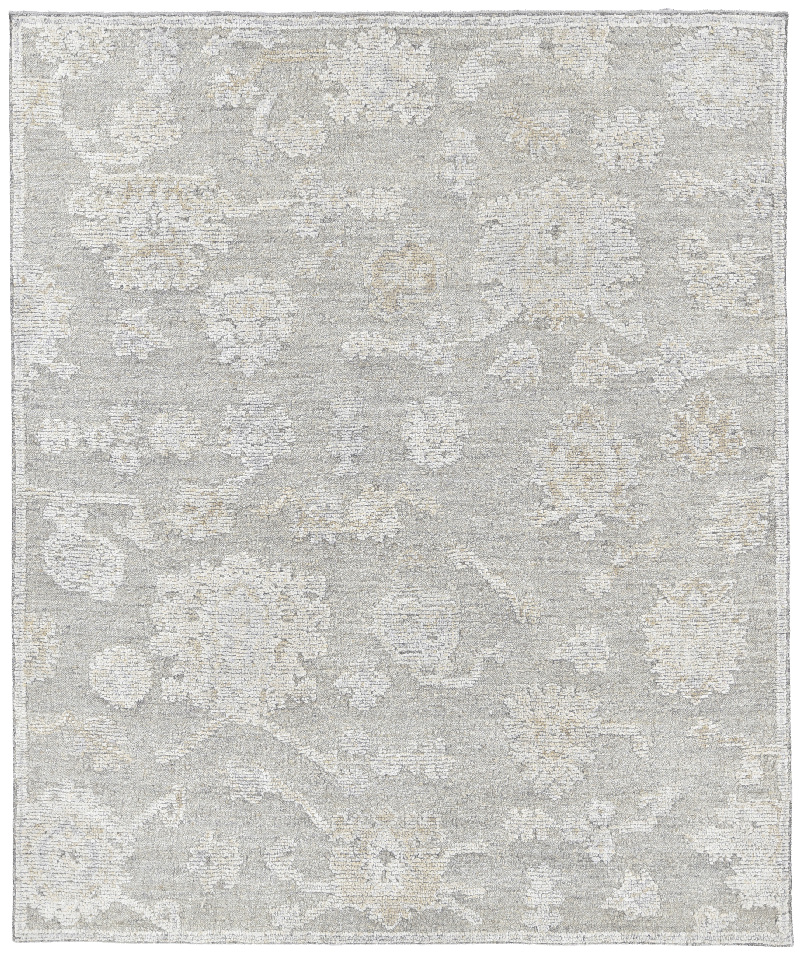 Overhead image of the Olan rug from the Oushak Collection, featuring a textured grey, taupe and cream pattern beneath a white