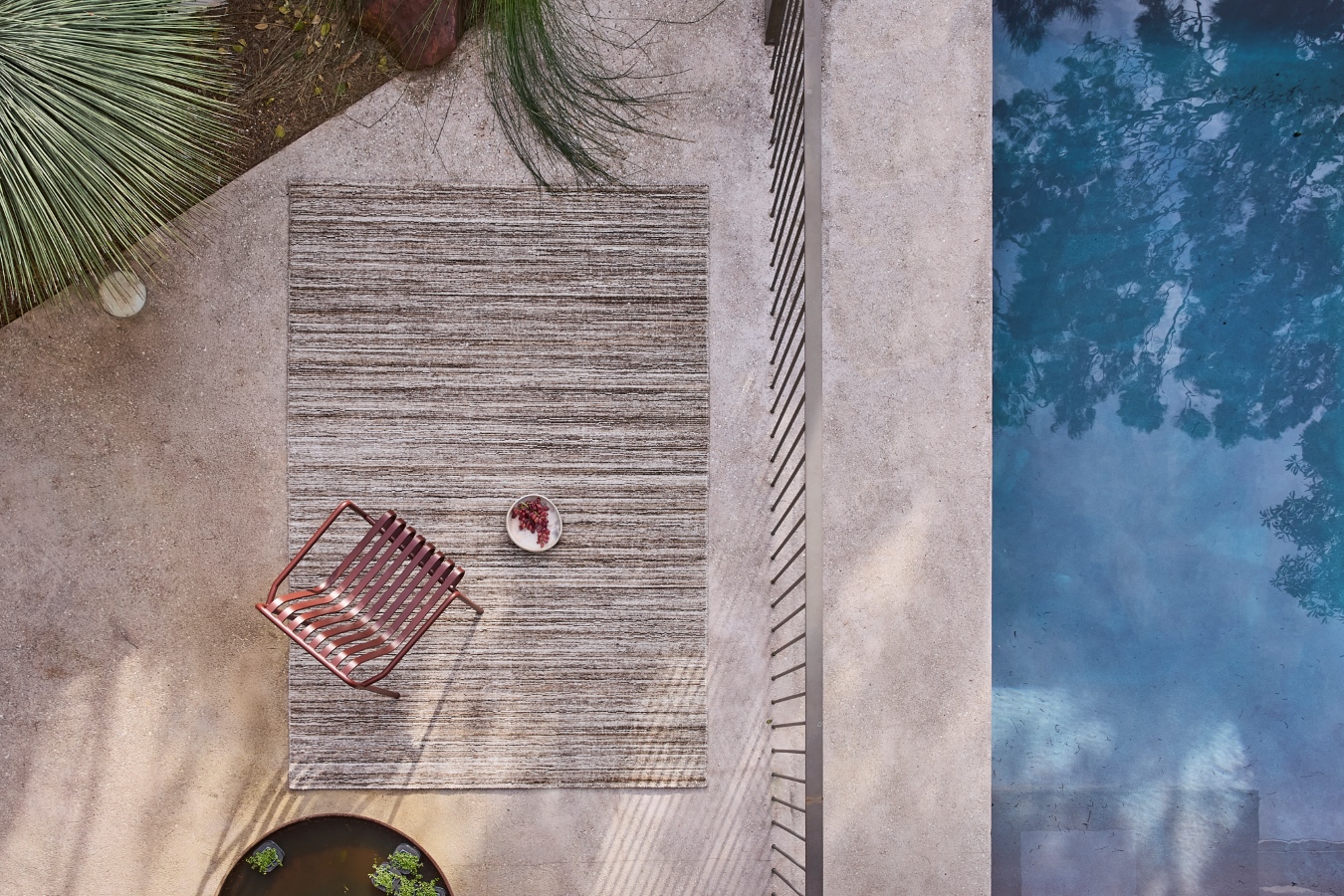 Location image of the Cove Taupe outdoor rug by Designer Rugs, showing its handloom-knotted texture and subtle taupe tones that bring warmth and elegance to outdoor spaces.