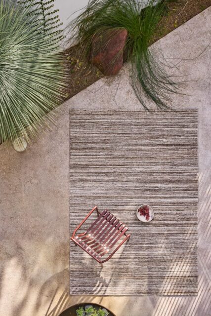 Location image of the Cove Taupe outdoor rug by Designer Rugs, showing its handloom-knotted texture and subtle taupe tones that bring warmth and elegance to outdoor spaces.