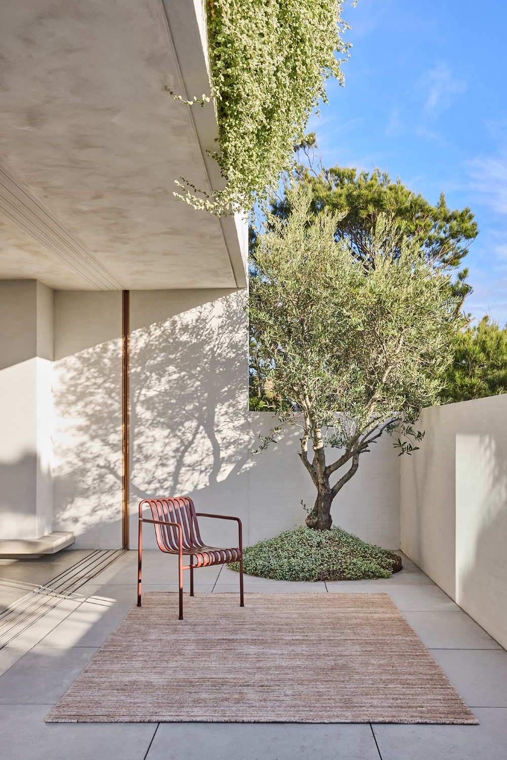 Location image of the Cove Linen outdoor rug by Designer Rugs, showing its handloom-knotted texture and subtle taupe tones that bring warmth and elegance to outdoor spaces.