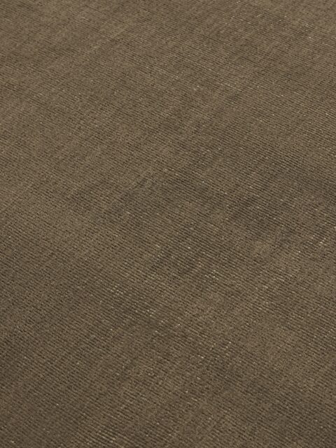 close up image of the Ravira rug in Taupe & Beige, showcasing its handknotted texture and subtle tonal pattern in warm neutral shades.