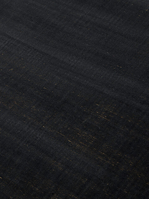 close up image of Ravira handknot rug in charcoal and honey colours